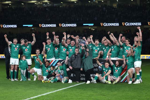 The Ireland team celebrate with the Tripple Crown following their sides victory in the Six Nations Rugby match between Ireland and Scotland at Aviva Stadium 