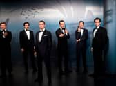 Wax figures of James Bond actors (L-R) Roger Moore, Timothy Dalton, Daniel Craig, Sean Connery, George Lazenby and Pierce Brosnan at Madame Tussauds (Photo: STEFFI LOOS/AFP via Getty Images)