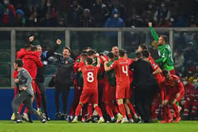 Aleksandar Trajkovski of North Macedonia (obscured) celebrates after scoring their side's first goal with team mates during the 2022 FIFA World Cup Qualifier knockout round play-off match between Italy and North Macedonia at Stadio Renzo Barbera on March 24, 2022 in Palermo, Italy