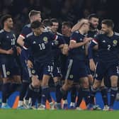 Kieran Tierney of Scotland celebrates after scoring their side's first goal during the international friendly match between Scotland and Poland at Hampden Park on March 24, 2022 in Glasgow, Scotland