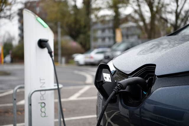 Electric vehicles (EV) charge at a charging station in east London  (Photo by Daniel LEAL / AFP) (Photo by DANIEL LEAL/AFP via Getty Images)