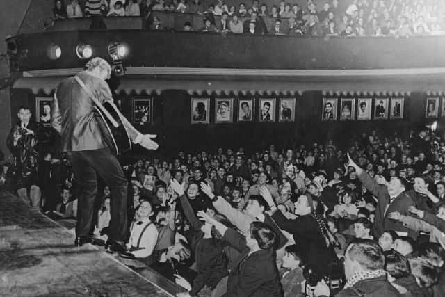 Johnny Halliday performing to fans in 1962 (Photo by Keystone/Hulton Archive/Getty Images)