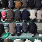 Muslim men pray at Baitul Futuh Mosque in Morden on February 18, 2011 in London, England. 