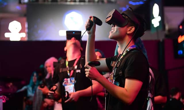People experience Virtual Clubbing wearing Redpill VR goggles at the 2019 E3 event (Photo: FREDERIC J. BROWN/AFP via Getty Images)