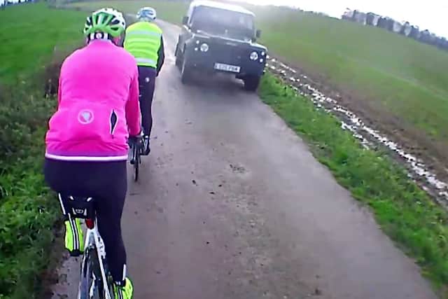 Web users said the driver should have slowed down or stopped to allow the cyclists to pass safely (Photo: Northamptonshire Police / SWNS)