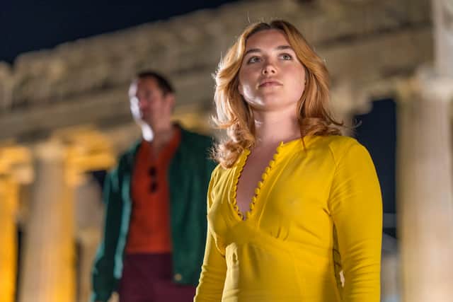 Florence Pugh, wearing yellow, as Charlie in The Little Drummer Girl (Credit: Jonathan Olley/AMC/Ink Factory)