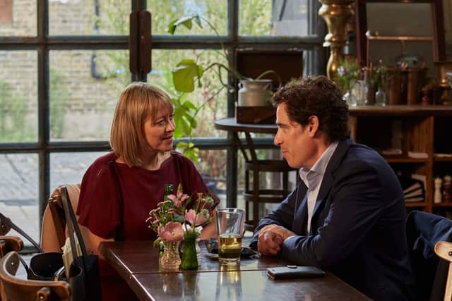 Nicola Walker as Hannah and Stephen Mangan as Nathan Stern, sat across from one another in a restaurant (Credit: Tereza Cervenova/BBC/Sister)