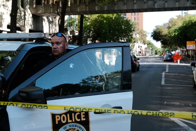 Police officers work the scene of a shooting where six people were killed (Photo: David Odisho/Getty Images)