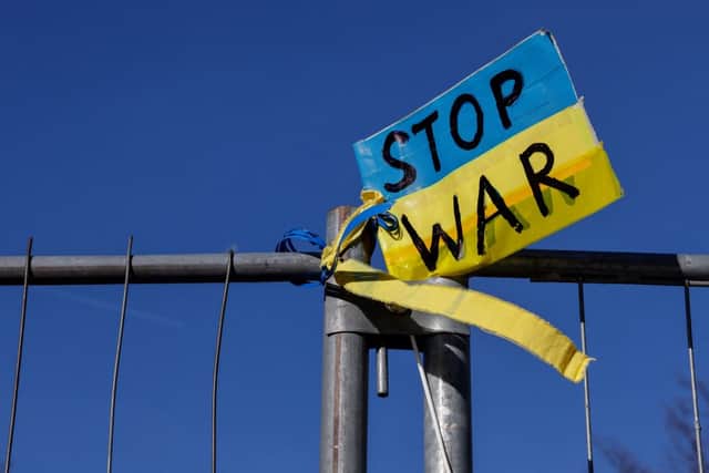An anti-war sign in the colours of the Ukrainian flag (Photo: DAVID GANNON/AFP via Getty Images)