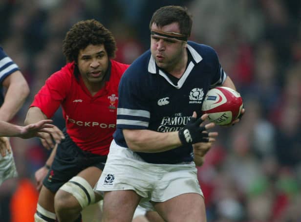 <p>Tom Smith of Scotland makes a break during the Six Nations match between Wales and Scotland at The Millennium Stadium on February 14, 2004</p>