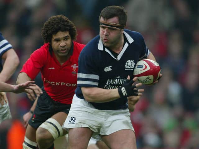 <p>Tom Smith of Scotland makes a break during the Six Nations match between Wales and Scotland at The Millennium Stadium on February 14, 2004</p>