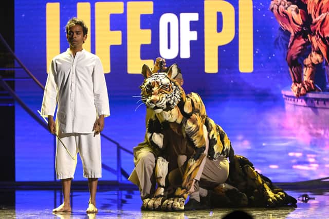 Hiran Abeysekera performs on stage with the cast of Life of Pi during The Olivier Awards 2022 (Photo: Jeff Spicer/Getty Images for SOLT)