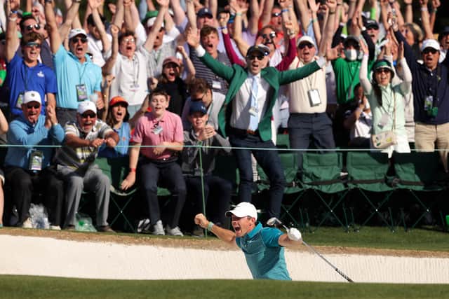 Rory McIlroy reacts after chipping in for birdie from the bunker (Photo by Jamie Squire/Getty Images)