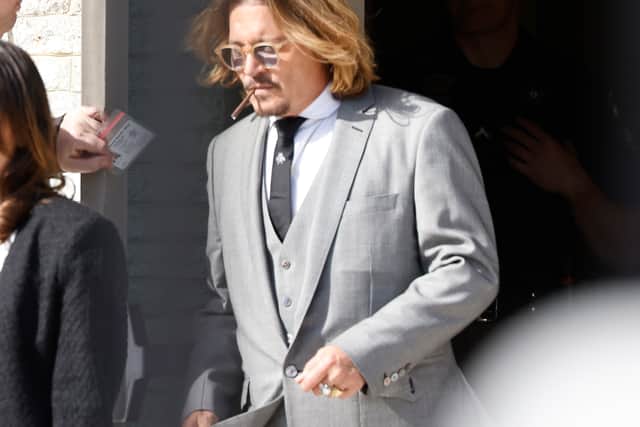 Johnny Depp is seen outside court for the start of a civil trial at Fairfax County Circuit Court on April 11, 2022 in Fairfax, Virginia. Depp is seeking $50 million in alleged damages to his career over an op-ed Heard wrote in the Washington Post in 2018. (Photo by Paul Morigi/Getty Images)