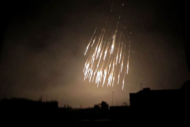 A picture showing what appears to be white phosphorus incendiaries landing during  bombardment on the outskirts of the capital Syrian capital Damascus (Photo: HAMZA AL-AJWEH/AFP via Getty Images)