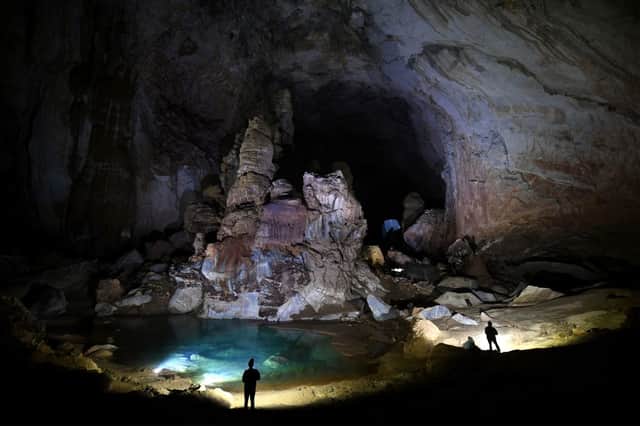 Visitors in Son Doong cave, one of the world’s largest natural caves, during a tour in central Vietnam (Photo:y NHAC NGUYEN/AFP via Getty Images)