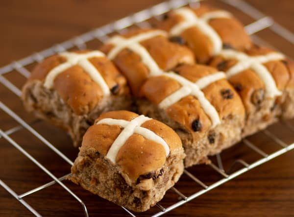 Hot cross buns have been eaten in the UK for centuries but their origins are clouded in mystery (image: Adobe)