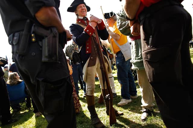 People often take part in battle reenactments as part of Patriots’ Day celebrations. (credit: Getty Images)