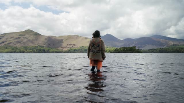 Clara Rugaard as Neve Kelly, waking up in the lake, in The Rising (Credit: Vishal Sharma/Sky)
