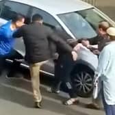 Mobile phone footage shows a group of men clashing in the street where campaigners had been canvassing.