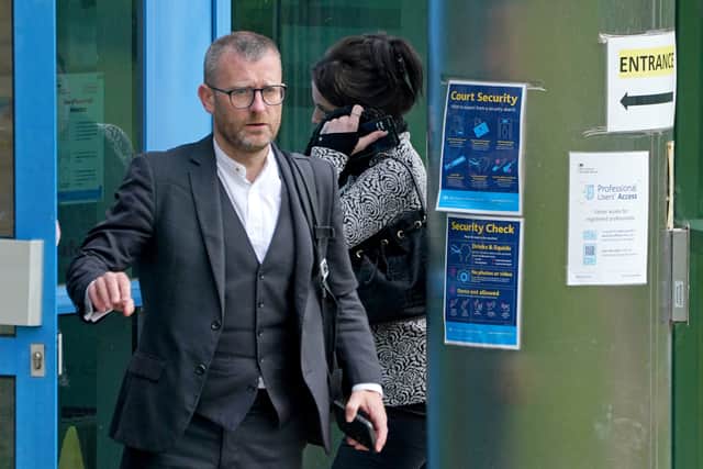 Katie Jarvis is let into the building by a member of staff as she arrives at Basildon Combined Court (Photo: PA)