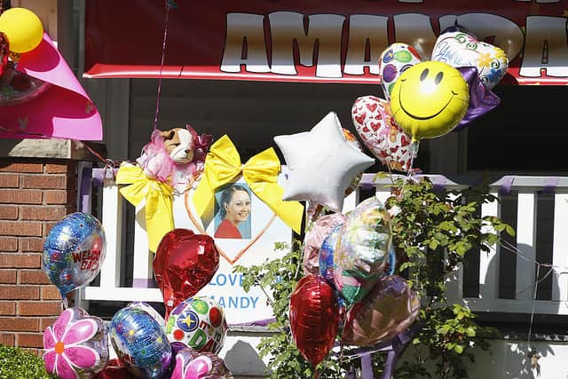 Balloons and presents sit outside the home of kidnap victim Amanda Berry on May 9, 2013 in Cleveland, Ohio (Photo: Matt Sullivan/Getty Images)