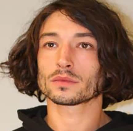 Ezra Miller seen in a police booking photo after their arrest for second-degree assault on April 19, 2022 in Pahoa, Hawaii. (Photo: Hawaii Police Department via Getty Images)