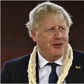 Boris Johnson, who has traveled to India today, vowed to fight the next general election despite calls for him to resign over the partygate scandal (PA)