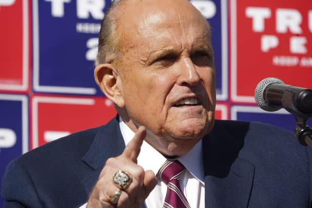Rudy Giuliani speaking at a news conference in the parking lot of a landscaping company (Photo: BRYAN R. SMITH/AFP via Getty Images)