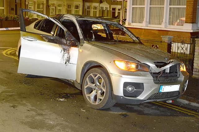 The burnt out car which was used by Bobby Ternent, 32, and his father Gary Ternent, 59, to murder John Avers, 47.