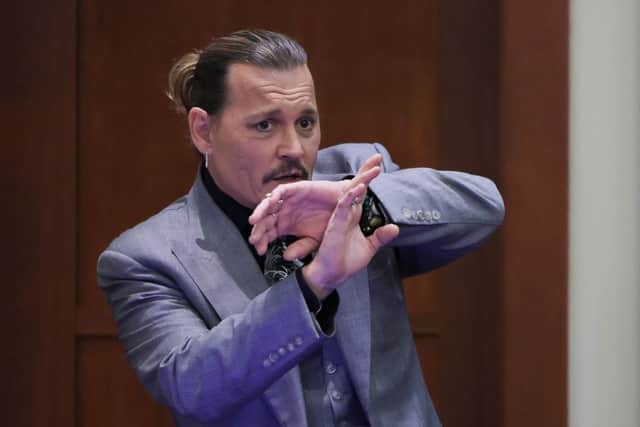 ohnny Depp demonstrating how he claims he shielded himself from an alleged attack by his ex-wife Amber Heard (Photo: EVELYN HOCKSTEIN/POOL/AFP via Getty Images)
