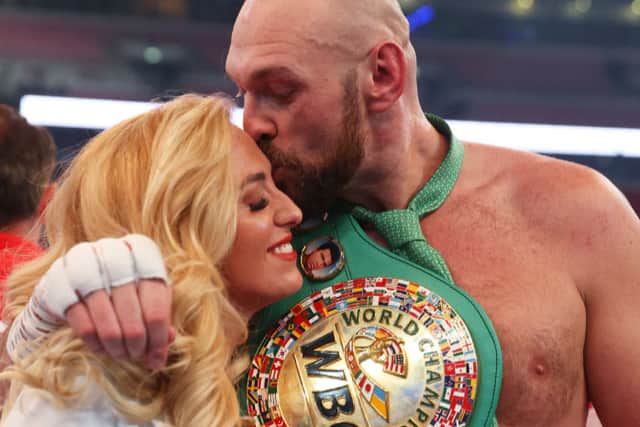 Tyson Fury celebrates victory with wife Paris Fury after the WBC World Heavyweight Title Fight against Dillian Whyte at Wembley Stadium on April 23, 2022 in London, England (Photo by Julian Finney/Getty Images)