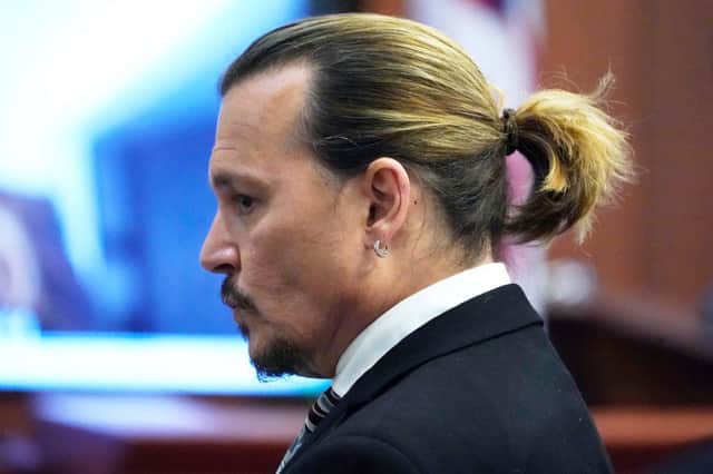 Johnny Depp waits for the jury to come into the courtroom after a break at the Fairfax County Circuit Courthouse (Photo by STEVE HELBER/POOL/AFP via Getty Images)