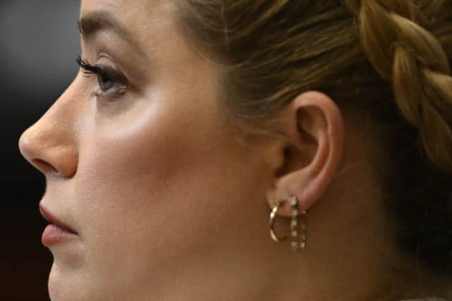 Amber Heard listens in the courtroom at the Fairfax County Circuit Courthouse in Fairfax, Virginia (Photo by BRENDAN SMIALOWSKI/POOL/AFP via Getty Images)
