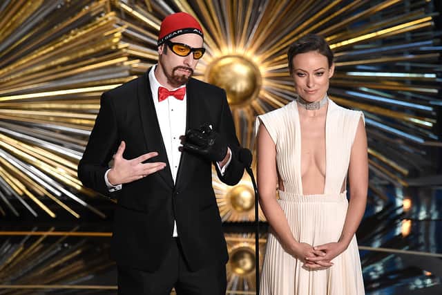 Sacha Baron Cohen as Ali G with Olivia Wilde onstage during the 88th Annual Academy Awards at the Dolby Theatre on February 28, 2016 in Hollywood, California  (Photo by Kevin Winter/Getty Images)