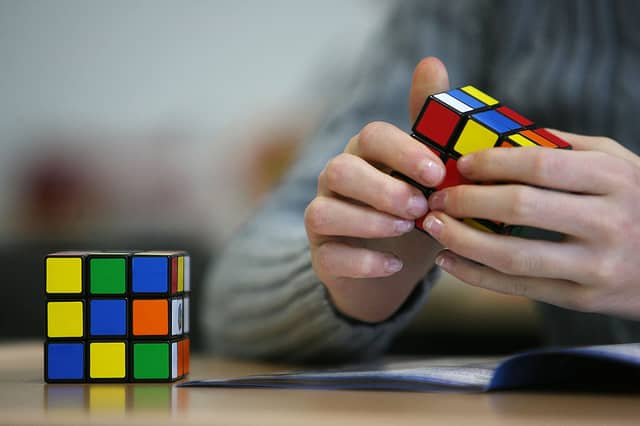 Have you successfully solved a rubik’s cube before? (Photo: PATRIK STOLLARZ/AFP via Getty Images)