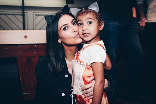Kim Kardashian and daughter, North West, on March 31, 2017 in Inglewood, California (Photo by Rich Fury/Forum Photos via Getty Images),