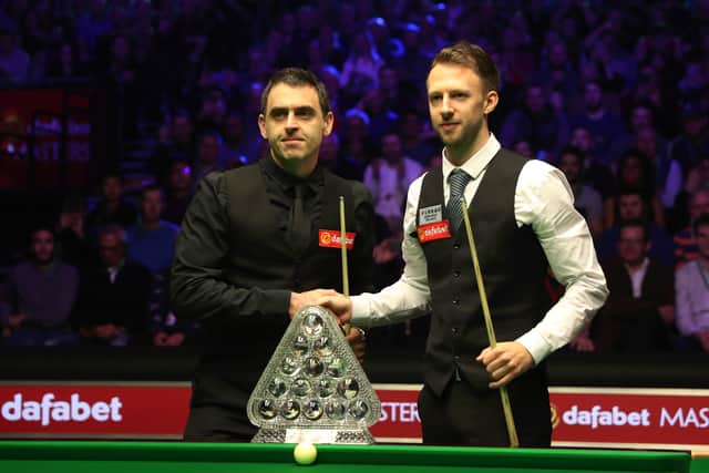 Ronnie O'Sullivan of England (L) and Judd Trump of England (R) shakes hands prior to The Dafabet Masters Final between Judd Trump of England and Ronnie O'Sullivan of England at Alexandra Palace on January 20, 2019