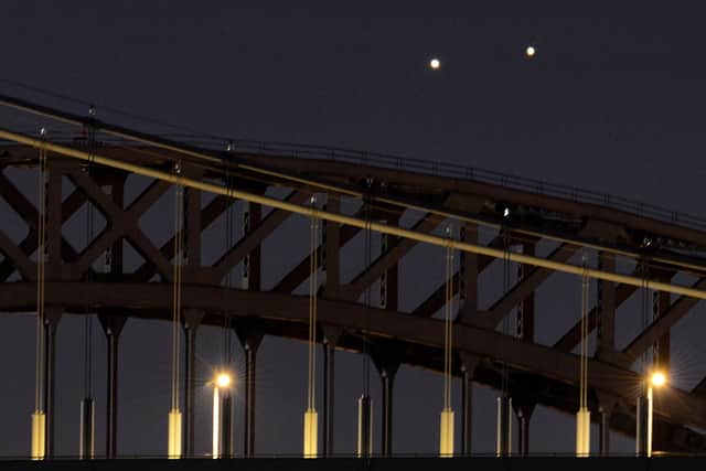 Venus (L) and Jupiter (R) rise together in a rare conjunction over New York in 2014 (Photo: STAN HONDA/AFP via Getty Images)