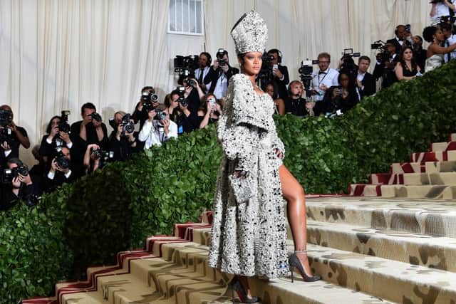 Rihanna arriving for the 2018 Met Gala on May 7, 2018, at the Metropolitan Museum of Art in New York - the 2018 theme was Heavenly Bodies: Fashion and the Catholic Imagination (Photo by HECTOR RETAMAL/AFP via Getty Images)
