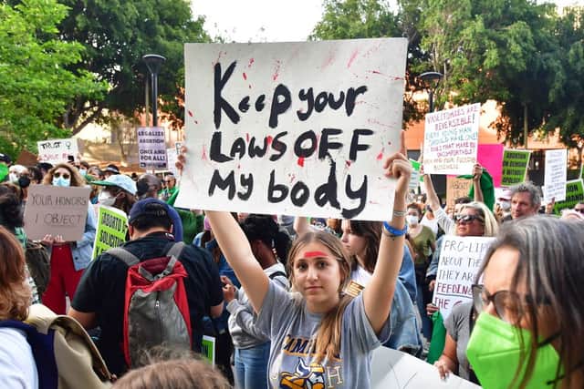 A person holds up a sign reading ‘Keep your Laws off my Body’ as pro-choice activists gather outside the US Courthouse to defend abortion rights in downtown LA on 3 May 2022 (Photo: FREDERIC J. BROWN/AFP via Getty Images)