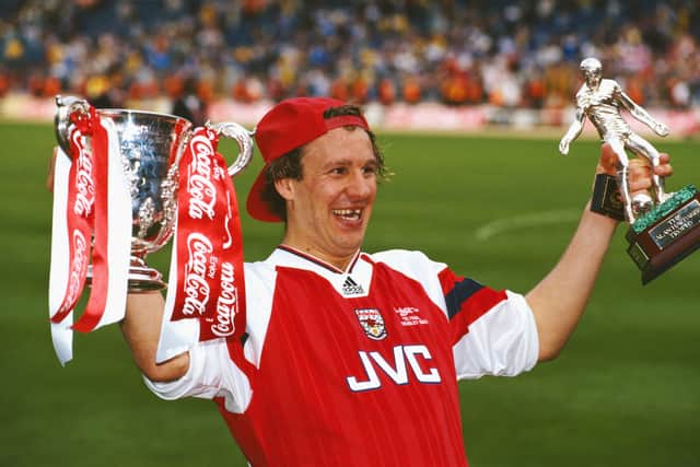 Merson celebrates League Cup and man of the match Trophy in 1993