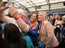Sinn Fein northern leader, Michelle O’Neill (R) and Mary Lou McDonald, Sinn Fein leader (C) pose for photos with candidates and activists (Photo: Getty Images)