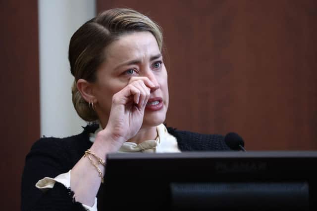 Amber Heard testifies at the Fairfax County Circuit Courthouse in Fairfax, Virginia, on May 5, 2022 (Photo by JIM LO SCALZO / POOL/POOL/AFP via Getty Images)