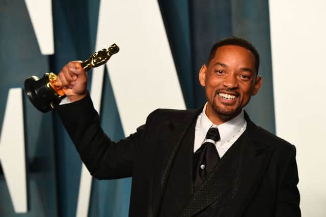 Will Smith holds his award for Best Actor in a Leading Role for “King Richard” as he attends the 2022 Vanity Fair Oscar Party following the 94th Oscars at the The Wallis Annenberg Center for the Performing Arts in Beverly Hills, California on March 27, 2022 (Photo by PATRICK T. FALLON/AFP via Getty Images)