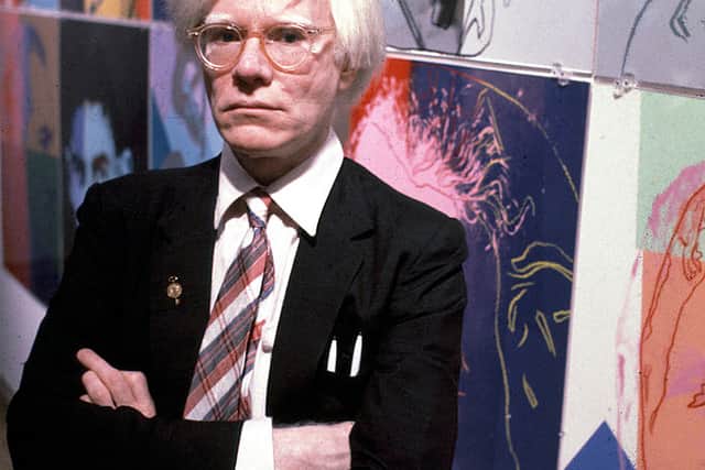 Andy Warhol with his paintings(1928 - 1987), December 15, 1980 (Photo by Susan Greenwood / Liaison Agency)