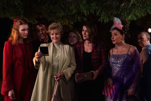 The adults reflect on their younger days, looking at polaroids from the 1977 leavers’ disco (Credit: Peter Marley/Channel 4)