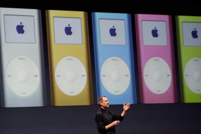 Former Apple CEO Steve Jobs announces the new mini iPod available in five colors during a keynote address at Macworld January 6, 2004 in San Francisco.