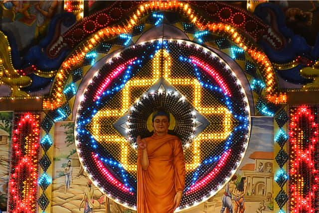 A view of a giant Vesak day display featuring a seated Buddha during the annual Buddhist festival of Vesak in Colombo