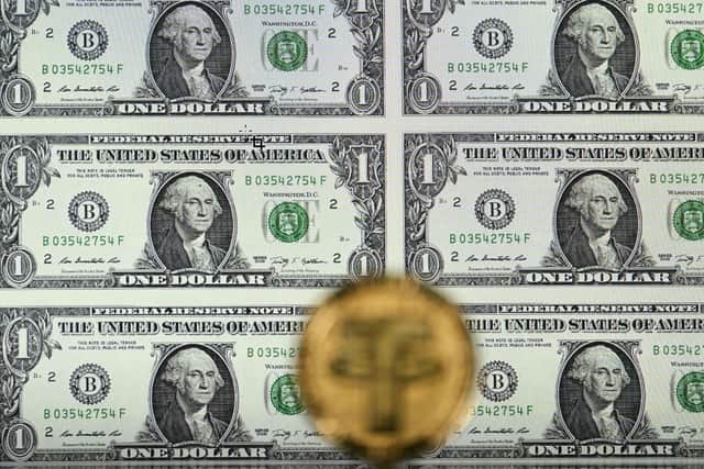 Most stablecoins are ‘pegged’ to the value of the US dollar (Photo: JUSTIN TALLIS/AFP via Getty Images)